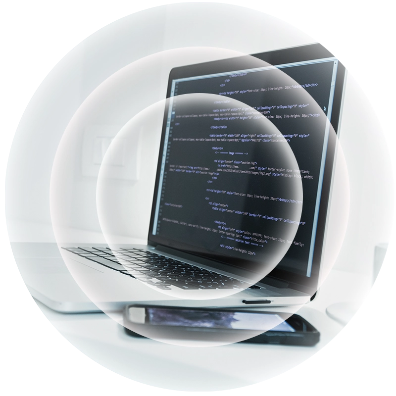 A laptop with a phone sat next to it with a white radar overlay.