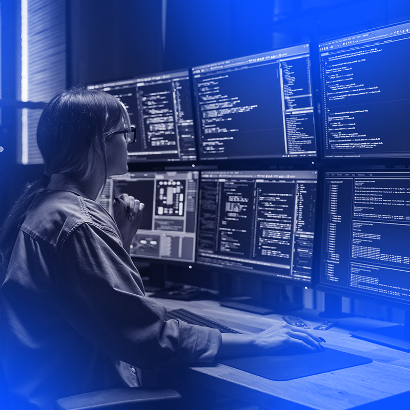 person and lots of computer screens